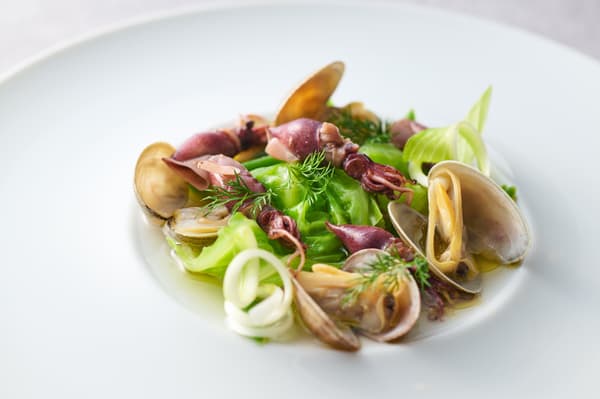 Firefly squid confit in clam and spring cabbage soup