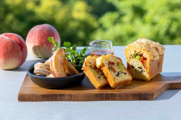 Rich peach served with a fragrant vinegar sauce alongside savory cake salé