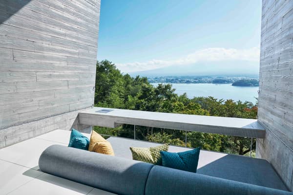 Breakfast enjoyed on a cabin terrace with a scenic lake view