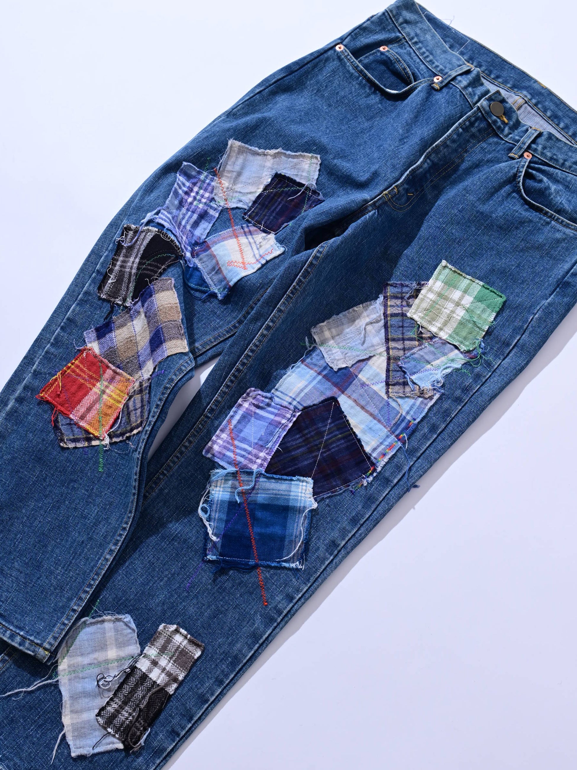 Detail of patchwork jeans
